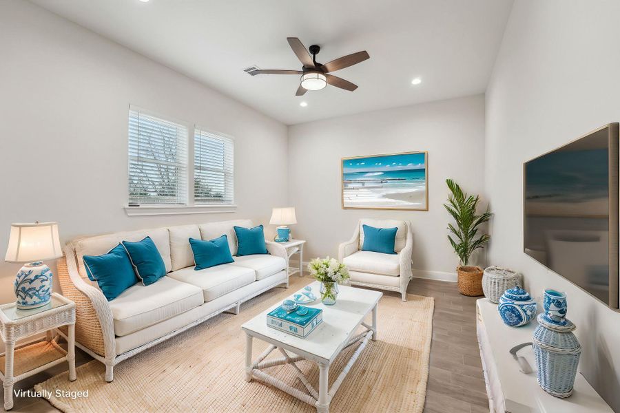 Virtually Staged Living area with recessed lighting, wood plank tile floor, baseboards, and ceiling fan Virtually Staged Living area with recessed lighting, wood plank tile floor, baseboards, and ceiling fan