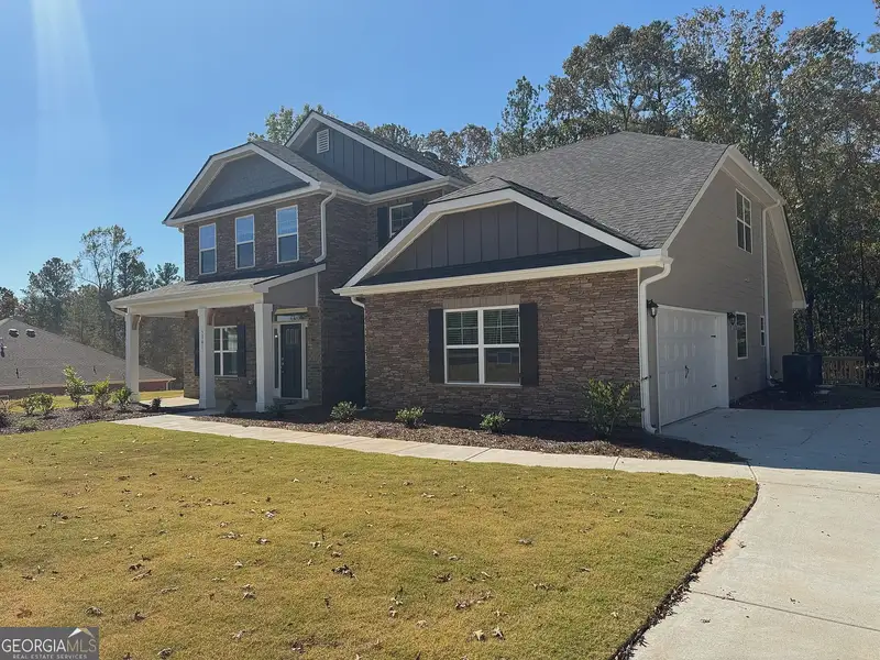 Front exterior of a new home in Tuscany Hills, Douglasville, GA, highlighting curb appeal (Image 17).