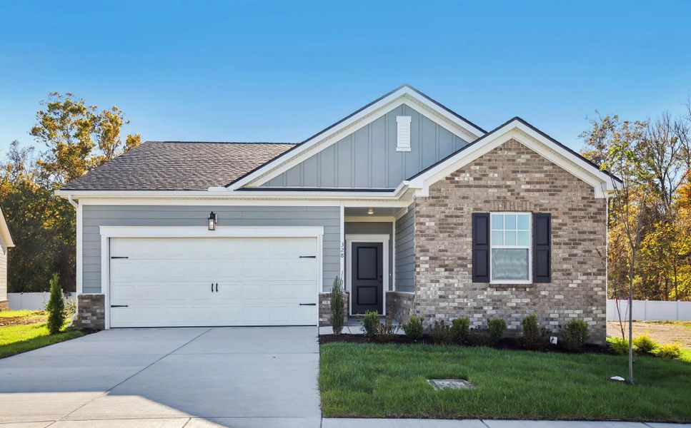 Front exterior of a new home in Cedars at Cane Ridge | 55+ Community, Antioch, TN, highlighting curb appeal (Image 1). Front exterior of a new home in Cedars at Cane Ridge | 55+ Community, Antioch, TN, highlighting curb appeal (Image 1).