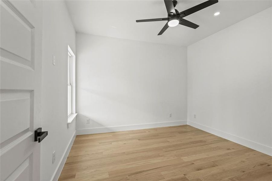 Spare room featuring light wood-type flooring and ceiling fan