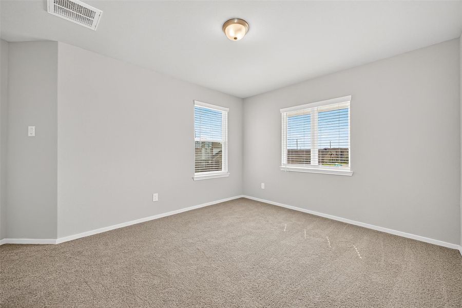 Spacious, unfurnished interior of a new home in Sunterra, Katy (Image 35).