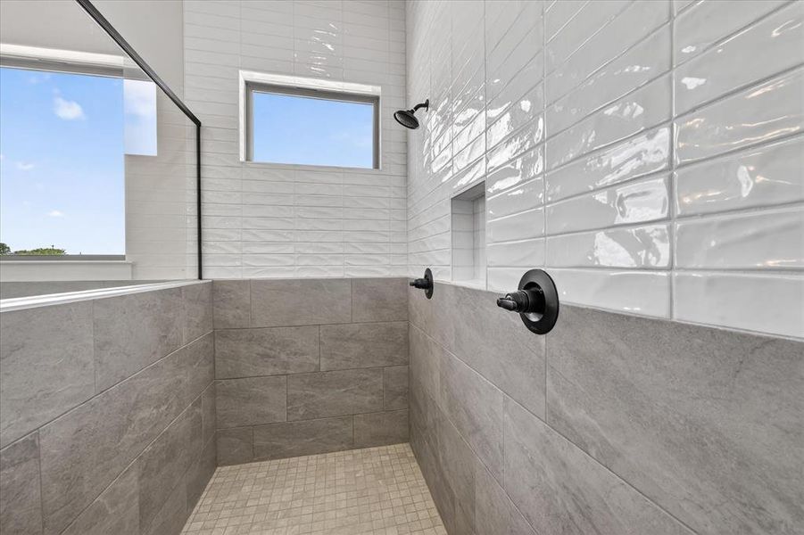 Full bathroom with tiled shower