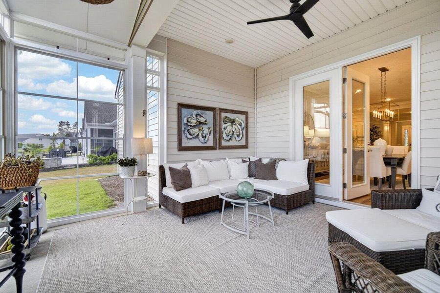 Exterior details and patio area of a home in K. Hovnanian's® Four Seasons at Lakes of Cane Bay, Summerville (Image 25).