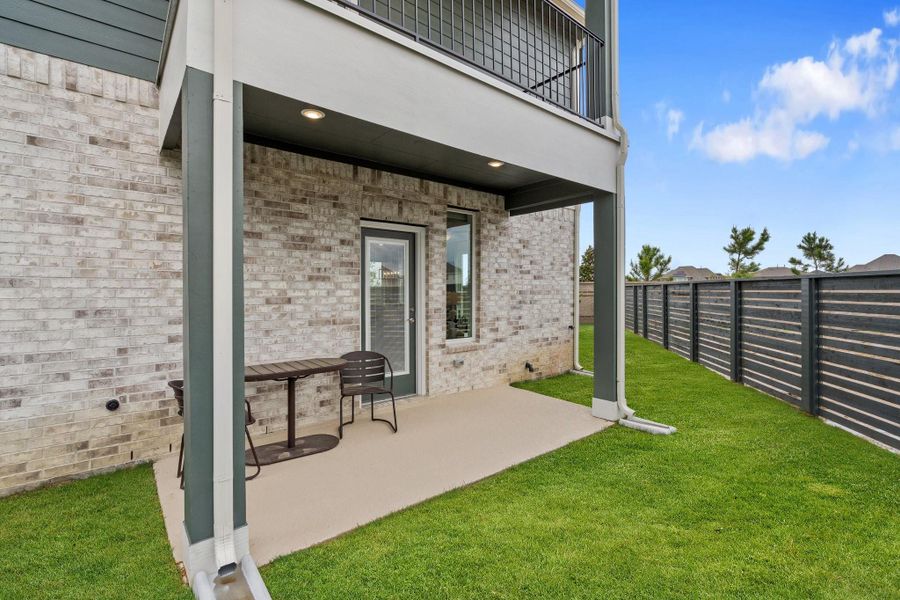 Exterior details and patio area of a home in Bridgeland Courtyard, Cypress (Image 3).
