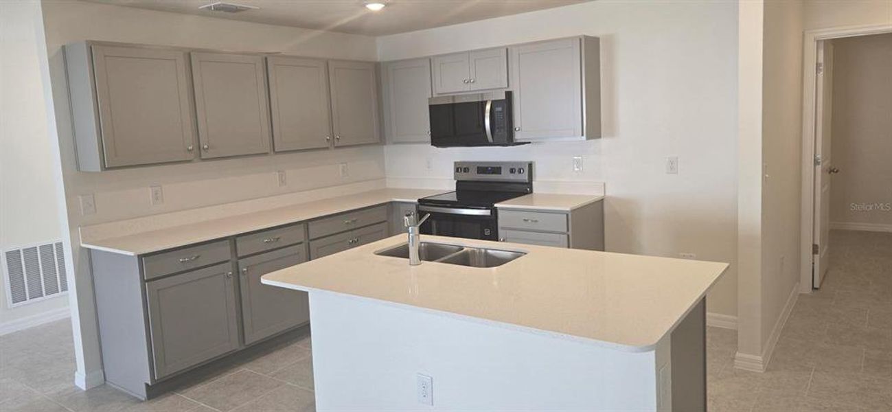 Furnished interior view inside a new home in , Poinciana (Image 6). Furnished interior view inside a new home in , Poinciana (Image 6).