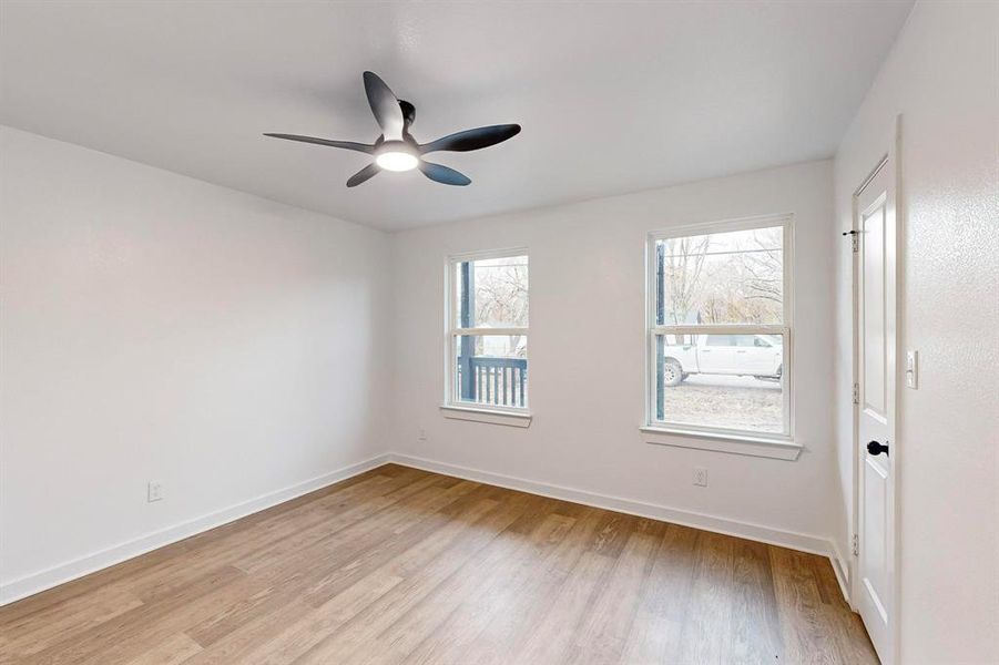 Spare room featuring light hardwood / wood-style floors and ceiling fan