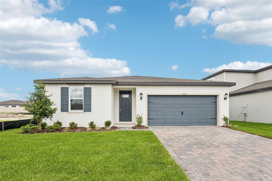Front exterior of a new home in Two Rivers - Classic Series, Zephyrhills, FL, highlighting curb appeal (Image 2).