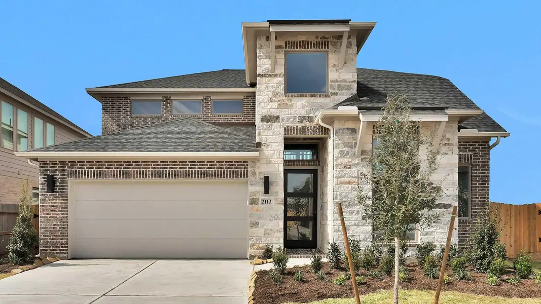 Front exterior of a new home in StoneCreek Estates, Richmond, TX, highlighting curb appeal (Image 10).