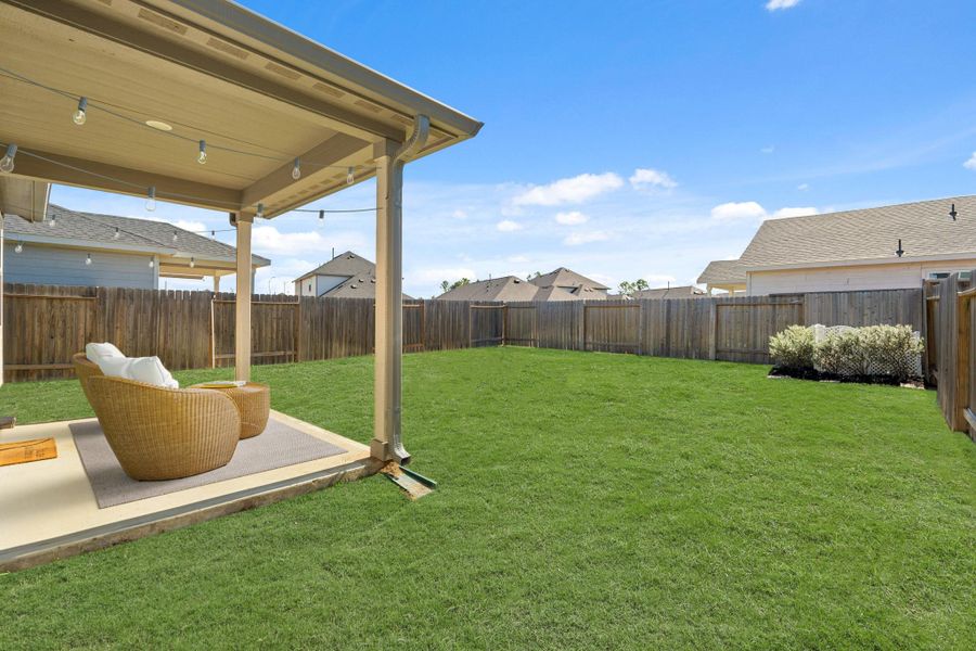 Step outside to enjoy the spacious backyard, complete with a covered patio! It's the perfect setup for outdoor dining, lounging, or weekend barbecues.
