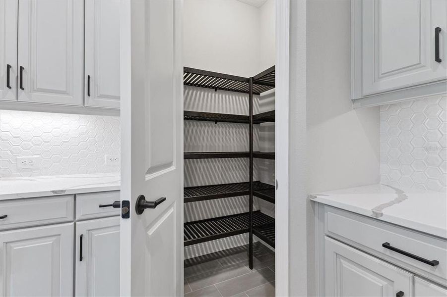 Custom walk in pantry shelving system.