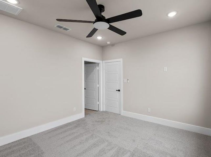 Empty room featuring carpet flooring, recessed lighting, and ceiling fan