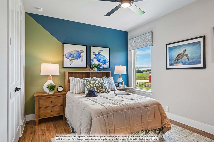 Bedroom with blue and green accent wall, wood headboard, ceiling fan, and hardwood floors Bedroom with blue and green accent wall, wood headboard, ceiling fan, and hardwood floors