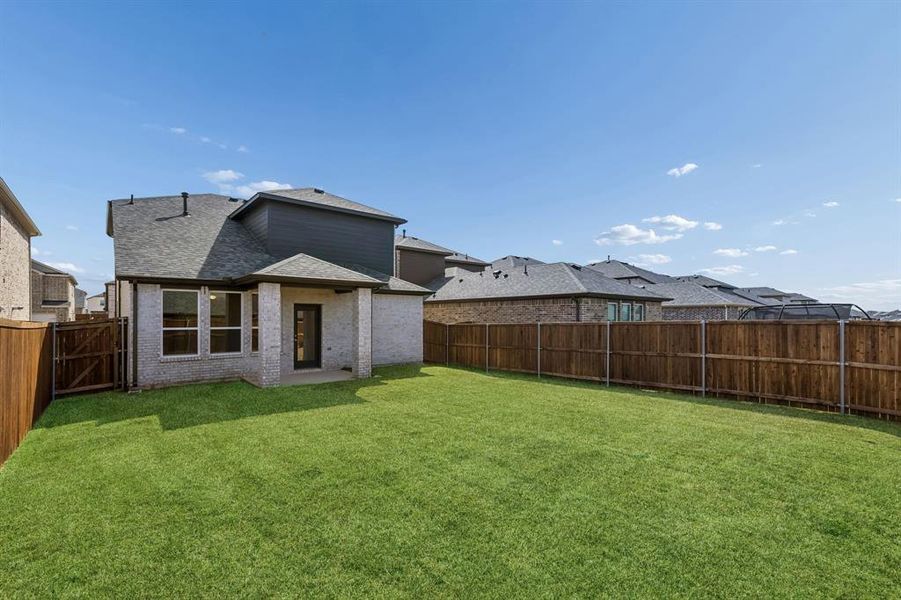Exterior details and patio area of a home in AnaCapri, Anna (Image 3).