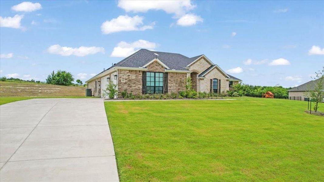 Front exterior of a new home in King Crossing Estates, Van Alstyne, TX, highlighting curb appeal (Image 25).