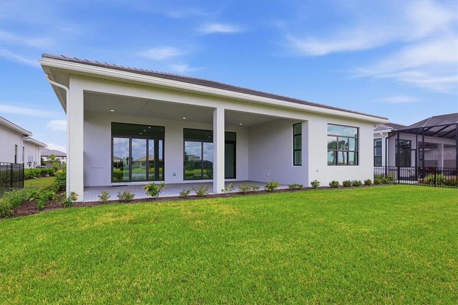Exterior details and patio area of a home in , Sarasota (Image 33).