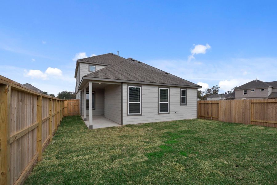Exterior details and patio area of a home in Cypresswood Landing, Humble (Image 4).