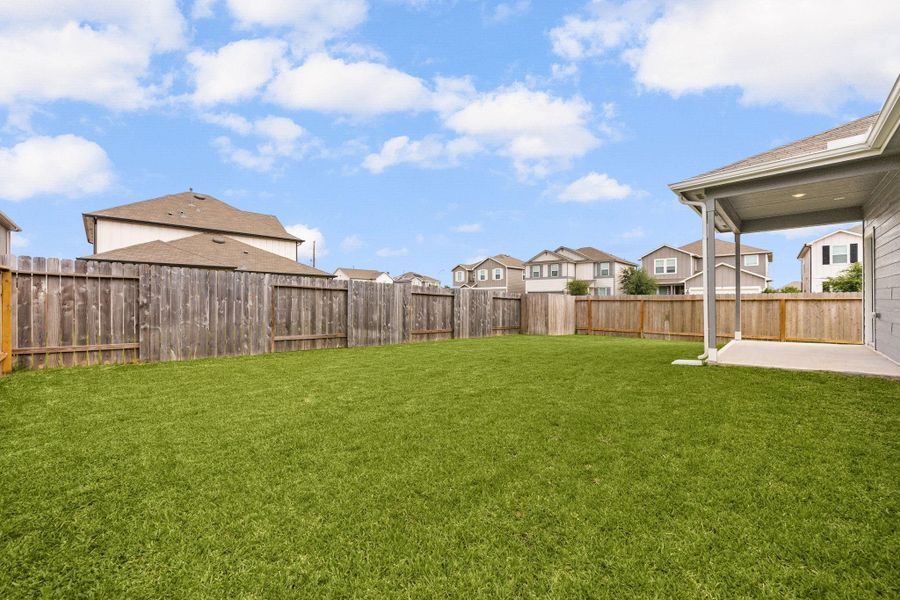 Spacious backyard provides endless possibilities for outdoor living and recreation.