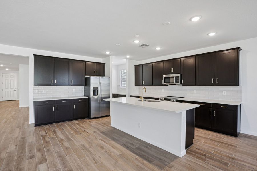 Kitchen - Sanctuary at Stonebridge Model Home. Finishes and options may vary by community