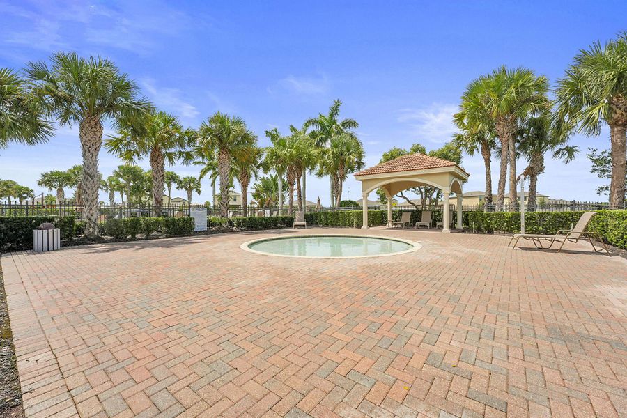 Front exterior of a new home in Bent Creek: The Meadows Collection, Fort Pierce, FL, highlighting curb appeal (Image 15).