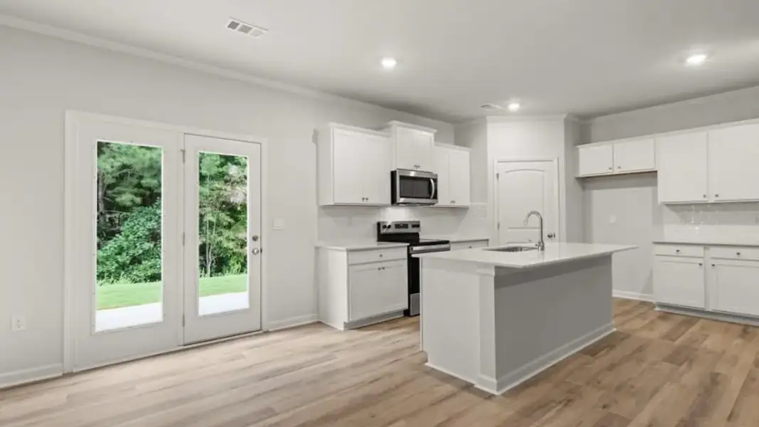 Furnished interior view inside a new home in Waypoint, Flowery Branch (Image 3).