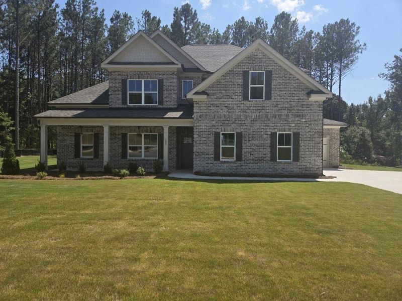 Front exterior of a new home in Palm Springs Manor Create Homes, Ellenwood, GA, highlighting curb appeal (Image 2). Front exterior of a new home in Palm Springs Manor Create Homes, Ellenwood, GA, highlighting curb appeal (Image 2).