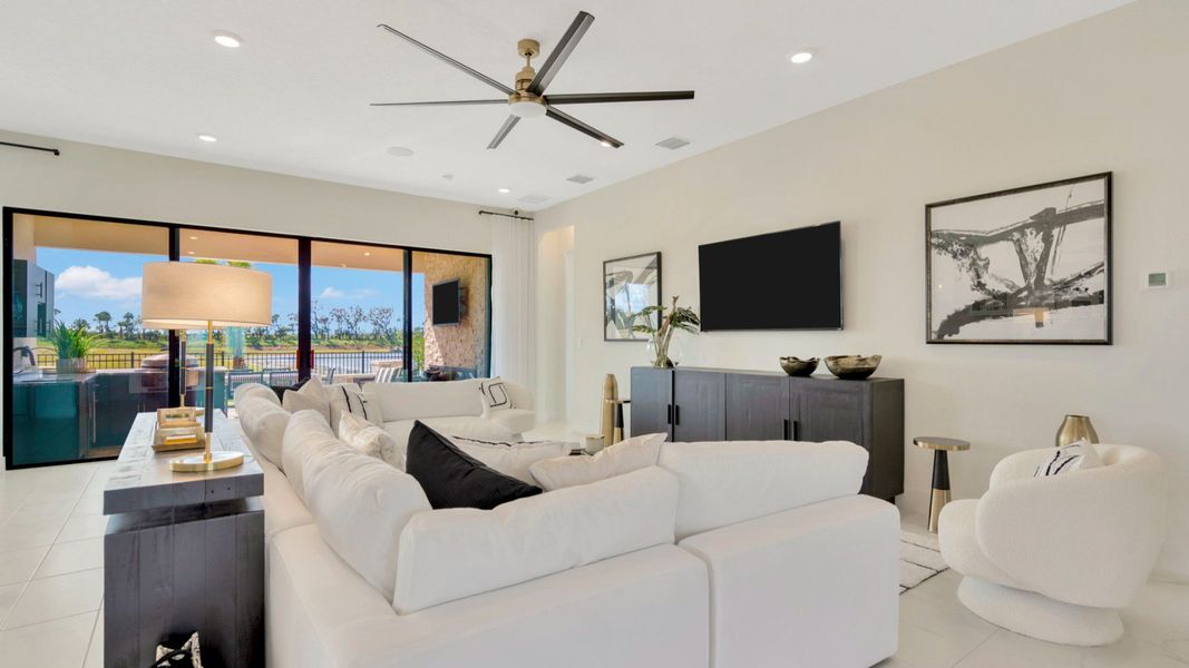 The Living Room of a DRB Homes Grand Eider model, which is a home plan offered at Serengeti in Spring Hill, FL.