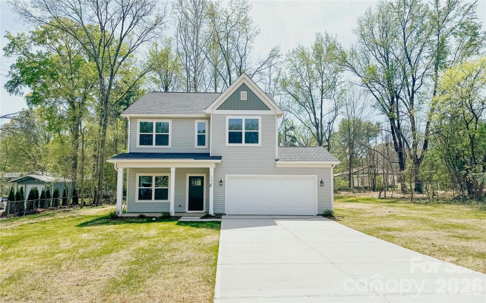 Front exterior of a new home in , Harrisburg, NC, highlighting curb appeal (Image 17).