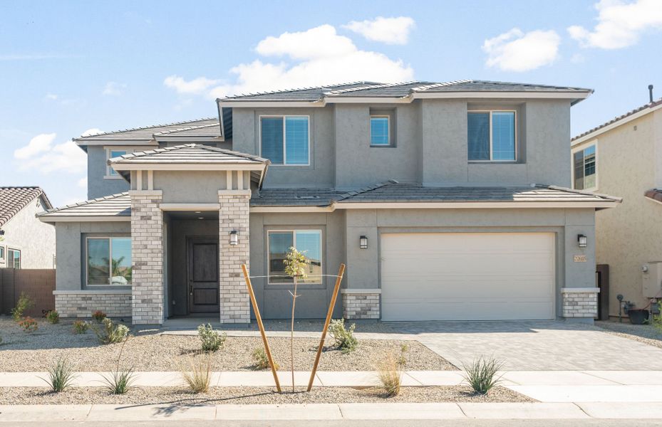 Front exterior of a new home in Harvest - Enchantment Series, Queen Creek, AZ, highlighting curb appeal (Image 1). Front exterior of a new home in Harvest - Enchantment Series, Queen Creek, AZ, highlighting curb appeal (Image 1).