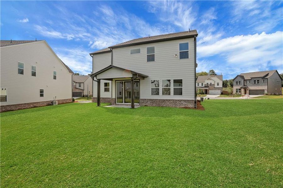 Exterior details and patio area of a home in The Paddocks at Doc Hughes, Buford (Image 32).