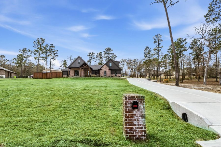 Front exterior of a new home in , Huntsville, TX, highlighting curb appeal (Image 27).