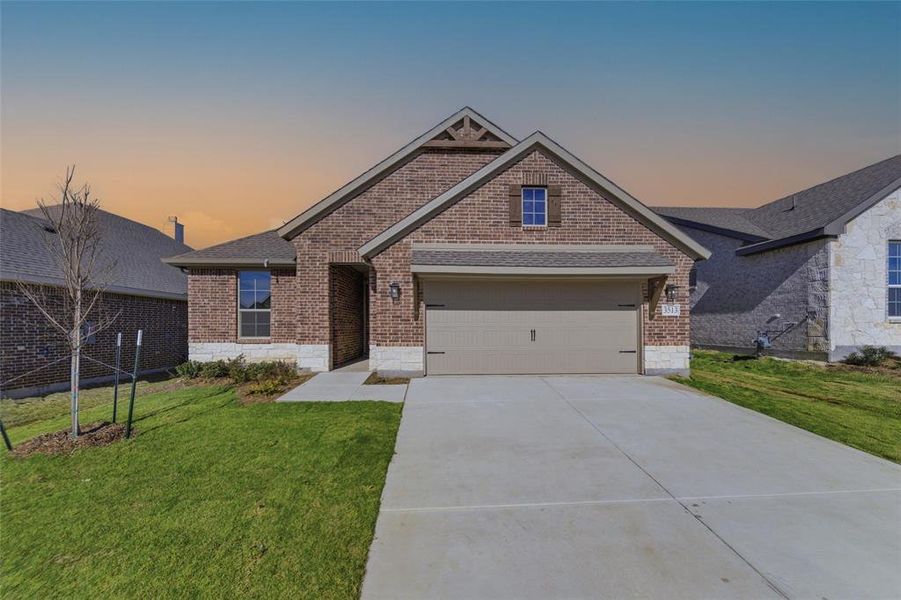 Front exterior of a new home in Liberty Pointe, Gainesville, TX, highlighting curb appeal (Image 15).