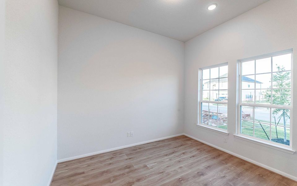 Unfurnished room featuring light wood-style floors and recessed lighting