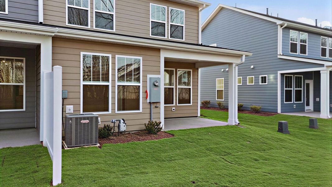 Refined rear exterior with a stylish covered porch for dining, relaxing, or entertaining