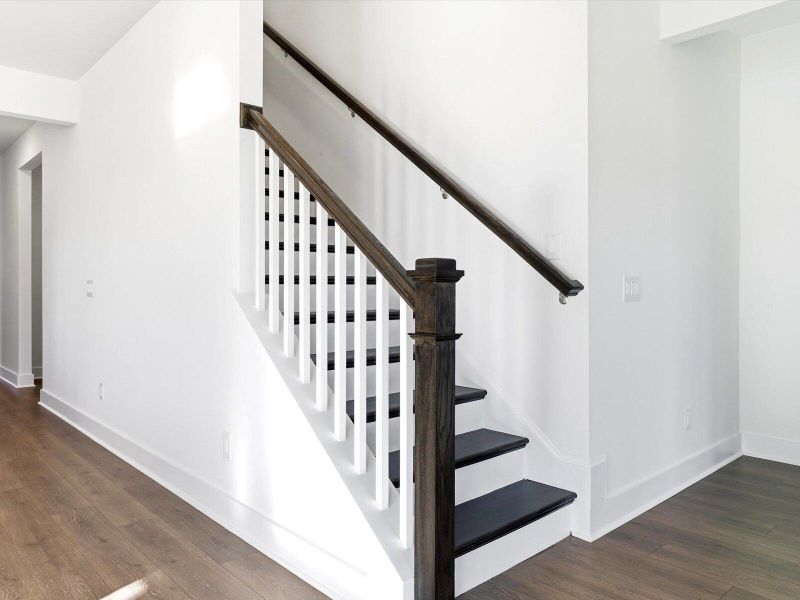 Spacious, unfurnished interior of a new home in The Coves at Lakes of Cane Bay, Summerville (Image 20).