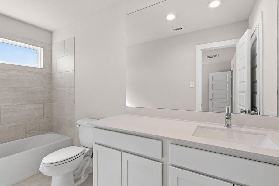 Furnished interior view inside a new home in Barton Creek Ranch, Conroe (Image 6).