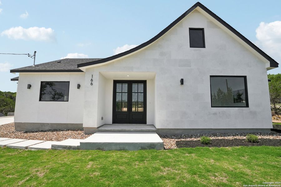 Front exterior of a new home in , Canyon Lake, TX, highlighting curb appeal (Image 1). Front exterior of a new home in , Canyon Lake, TX, highlighting curb appeal (Image 1).