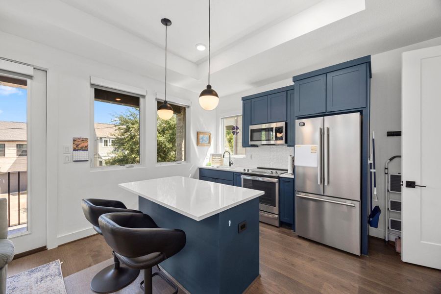 Casita includes a full kitchen with modern appliances, ample cabinetry, and functional counter space—perfect for guests, extended family.