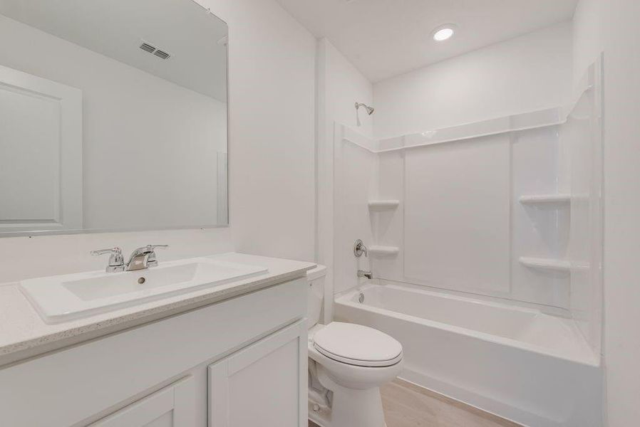 Bathroom featuring shower / bathtub combination and vanity