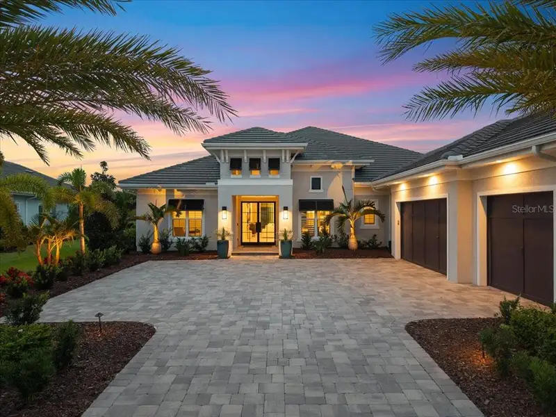 Front exterior of a new home in , Lakewood Ranch, FL, highlighting curb appeal (Image 23). Front exterior of a new home in , Lakewood Ranch, FL, highlighting curb appeal (Image 23).