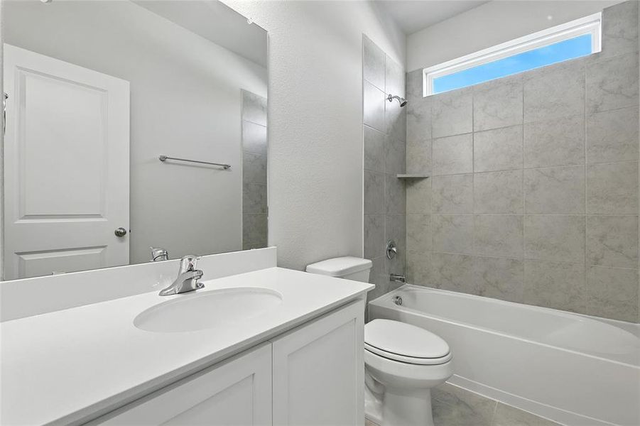 Full bathroom with vanity and washtub / shower combination