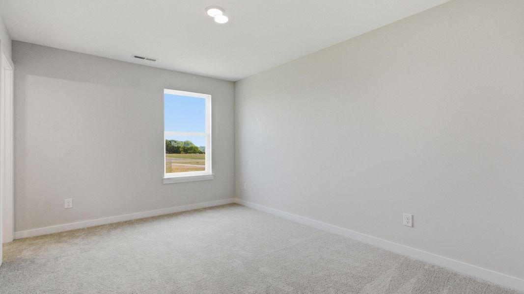 Upstairs secondary bedroom with window