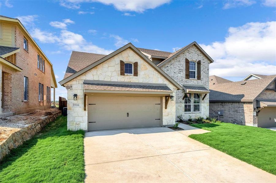 Front exterior of a new home in Liberty Pointe, Gainesville, TX, highlighting curb appeal (Image 2). Front exterior of a new home in Liberty Pointe, Gainesville, TX, highlighting curb appeal (Image 2).
