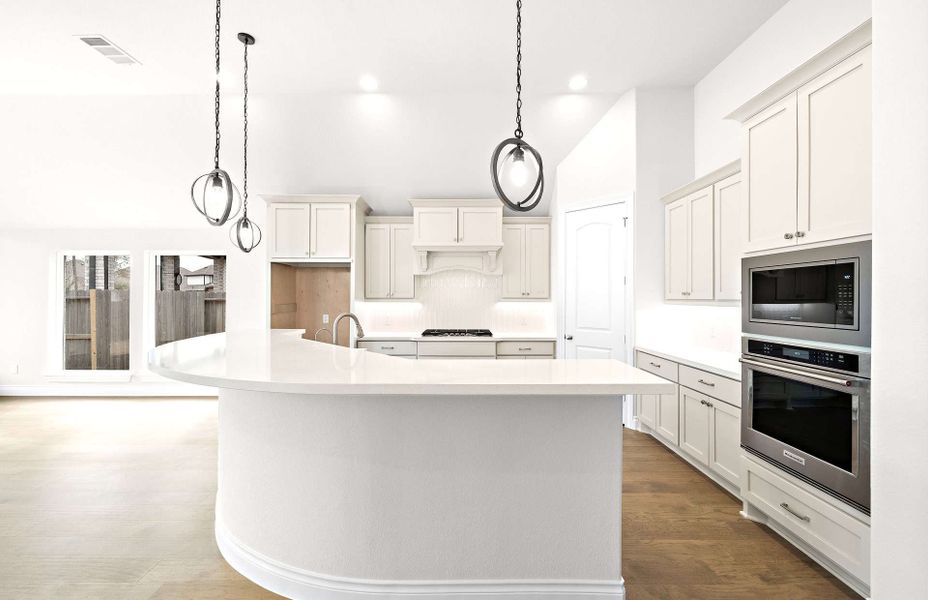 Representative furnished interior of a home built from the 2406 by Ravenna Homes in The Highlands 55′, Porter (Image 11).