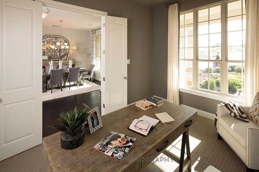 Office featuring carpet floors and a chandelier Office featuring carpet floors and a chandelier