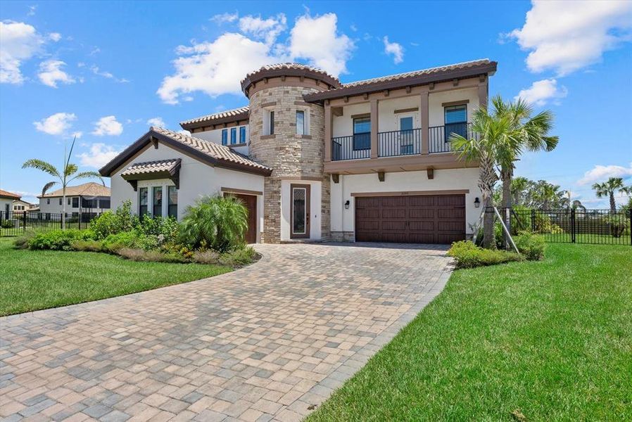 Front exterior of a new home in Crosswind Ranch, Parrish, FL, highlighting curb appeal (Image 24).