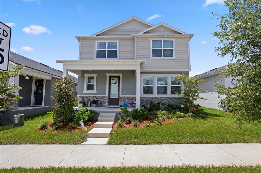 Front exterior of a new home in , Groveland, FL, highlighting curb appeal (Image 27).