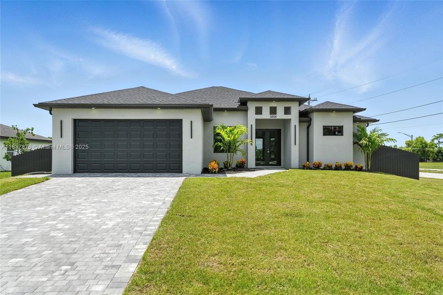Front exterior of a new home in , Cape Coral, FL, highlighting curb appeal (Image 19). Front exterior of a new home in , Cape Coral, FL, highlighting curb appeal (Image 19).