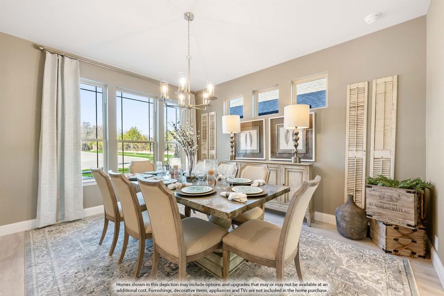 Dining room with rectangular table, six chairs, chandelier, and large windows with natural light