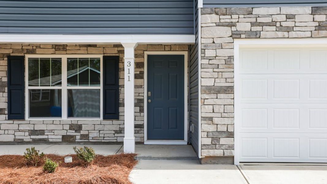 Exterior details and patio area of a home in Lakestone, Woodruff (Image 4).
