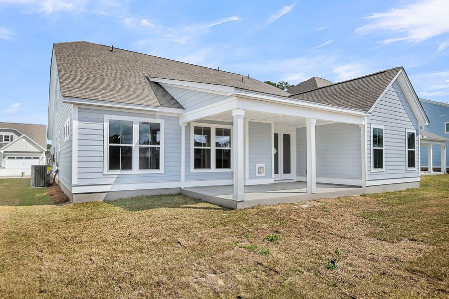 Exterior details and patio area of a home in Tidewater at Lakes of Cane Bay, Summerville (Image 3).